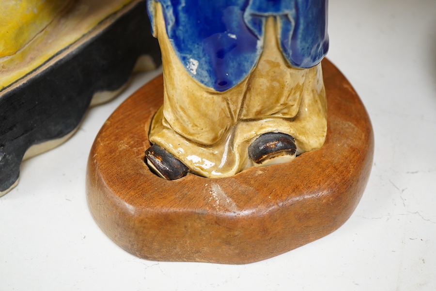 Two Chinese pottery glazed figures to include a Shiwan mudman, largest 48cm high